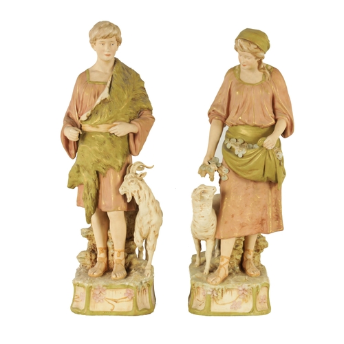 48 - A PAIR OF LATE 19TH CENTURY ROYAL DUX FIGURES well modelled as a shepherd and shepherdess decorated ... 