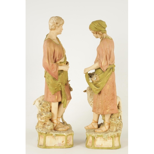 48 - A PAIR OF LATE 19TH CENTURY ROYAL DUX FIGURES well modelled as a shepherd and shepherdess decorated ... 