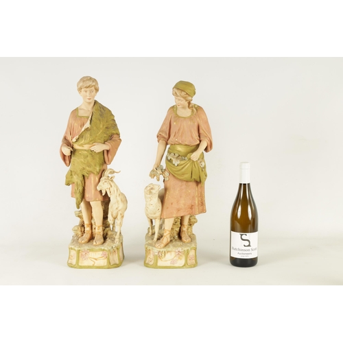 48 - A PAIR OF LATE 19TH CENTURY ROYAL DUX FIGURES well modelled as a shepherd and shepherdess decorated ... 