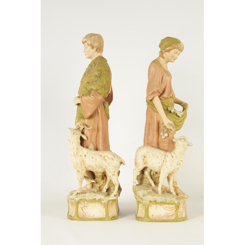 48 - A PAIR OF LATE 19TH CENTURY ROYAL DUX FIGURES well modelled as a shepherd and shepherdess decorated ... 