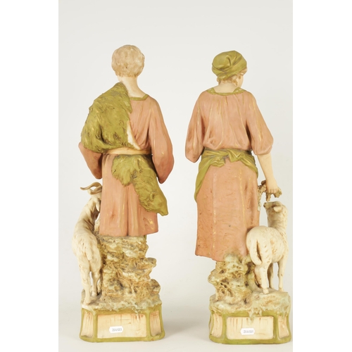 48 - A PAIR OF LATE 19TH CENTURY ROYAL DUX FIGURES well modelled as a shepherd and shepherdess decorated ... 