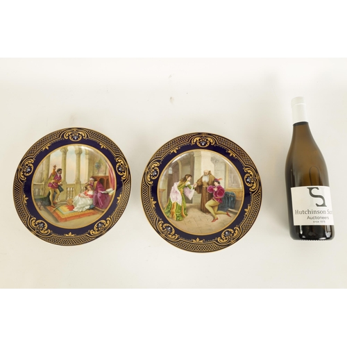 50 - A PAIR OF LATE 19TH CENTURY VIENNA TYPE CABINET PLATES each with trellised gilt royal blue border en... 