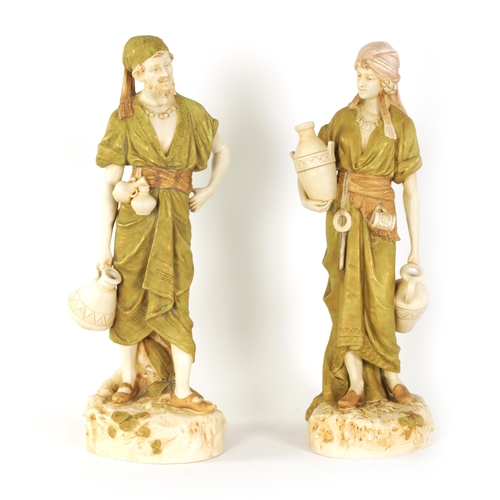 53 - A LARGE PAIR OF LATE 19TH/EARLY 20TH CENTURY ROYAL DUX STANDING FIGURES modelled depicting Eastern W... 