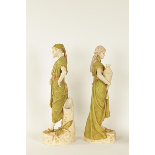 53 - A LARGE PAIR OF LATE 19TH/EARLY 20TH CENTURY ROYAL DUX STANDING FIGURES modelled depicting Eastern W... 