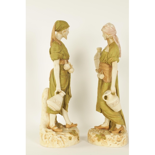 53 - A LARGE PAIR OF LATE 19TH/EARLY 20TH CENTURY ROYAL DUX STANDING FIGURES modelled depicting Eastern W... 