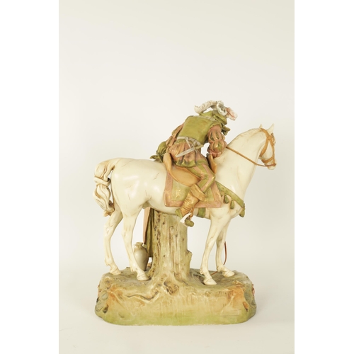 56 - A LATE 19TH CENTURY ROYAL DUX, BOHEMIA HORSE AND FIGURE GROUP finely modelled standing with a mounte... 