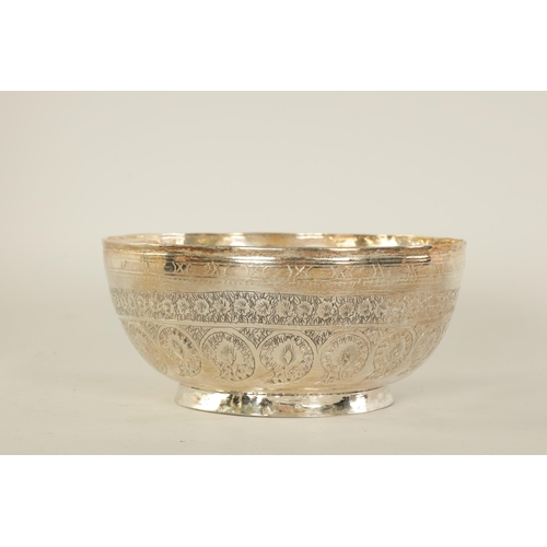 67 - AN EARLY 20TH CENTURY BURMESE SILVER BOWL with foliate engraved and embossed decoration, makers stam... 