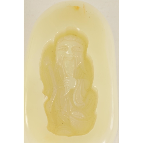 70 - A CHINESE CARVED JADE BOULDER DEPICTING A SAGE HOLDING A STAFF (11.5cm wide)