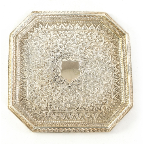 71 - A LATE 19TH/EARLY 20TH CENTURY INDIAN SILVER TRAY of square form with canted corners and repousse wo... 