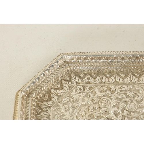 71 - A LATE 19TH/EARLY 20TH CENTURY INDIAN SILVER TRAY of square form with canted corners and repousse wo... 