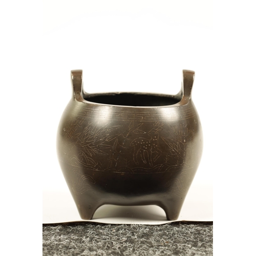 73 - AN 18TH/19TH CENTURY CHINESE BRONZE CENSER WITH SILVER WIRE INLAY of bulbous form with loop handles ... 