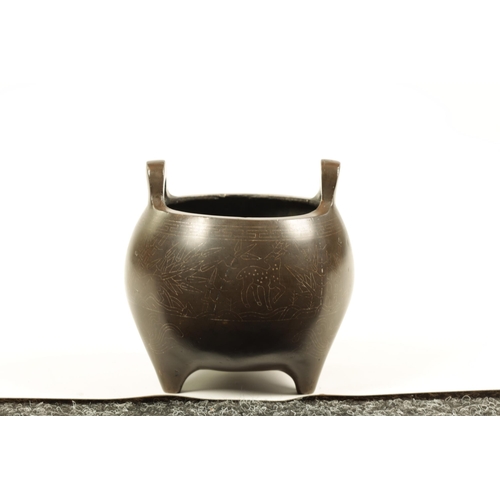 73 - AN 18TH/19TH CENTURY CHINESE BRONZE CENSER WITH SILVER WIRE INLAY of bulbous form with loop handles ... 