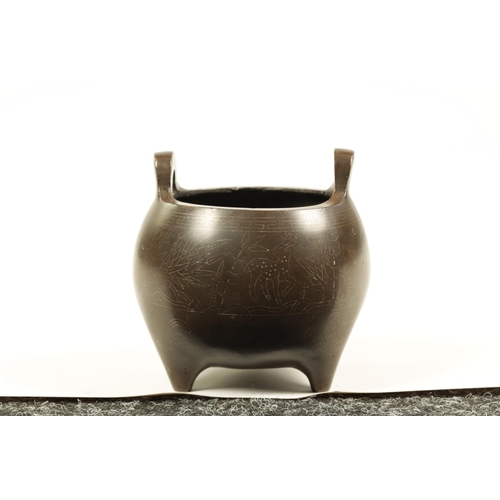 73 - AN 18TH/19TH CENTURY CHINESE BRONZE CENSER WITH SILVER WIRE INLAY of bulbous form with loop handles ... 