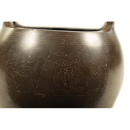 73 - AN 18TH/19TH CENTURY CHINESE BRONZE CENSER WITH SILVER WIRE INLAY of bulbous form with loop handles ... 