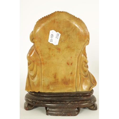 74 - A CHINESE CARVED SOAPSTONE SCULPTURE modelled as a seated Buddha on moulded plinth base. (20.5cm hig... 