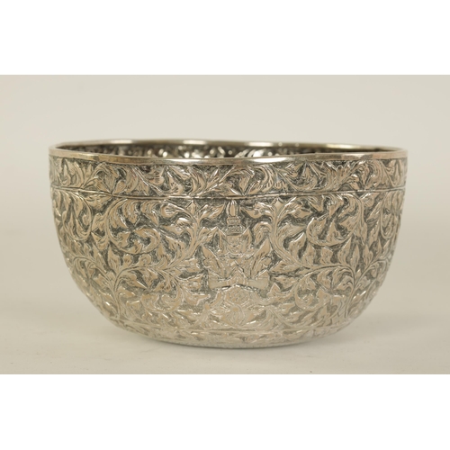 76 - A LATE 19TH CENTURY INDIAN SILVER BOWL with repousse work decoration of figures amongst scrolling le... 