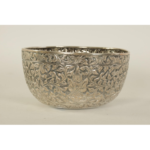 76 - A LATE 19TH CENTURY INDIAN SILVER BOWL with repousse work decoration of figures amongst scrolling le... 