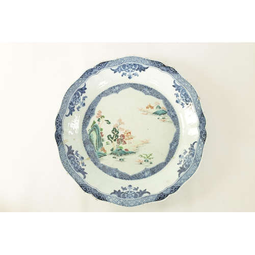 79 - AN 18TH CENTURY CHINESE BLUE AND WHITE SCALLOP EDGE DISH with hatched floral panelled border and inn... 