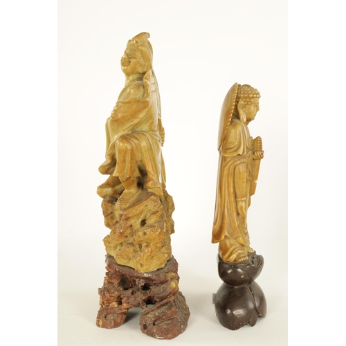 80 - TWO CHINESE SOAPSTONE FIGURAL CARVINGS modelled as mortals on carved bases (2) (Tallest 31cm high)