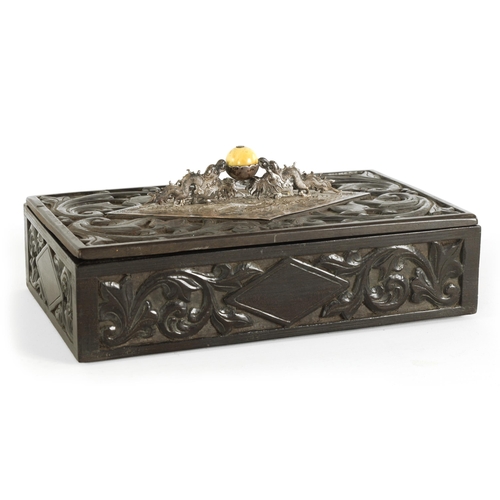 84 - A 19TH CENTURY CHINESE CARVED HARDWOOD (POSSIBLY ZITAN) LIDDED BOX with embossed silver-metal handle... 