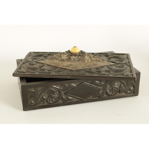 84 - A 19TH CENTURY CHINESE CARVED HARDWOOD (POSSIBLY ZITAN) LIDDED BOX with embossed silver-metal handle... 