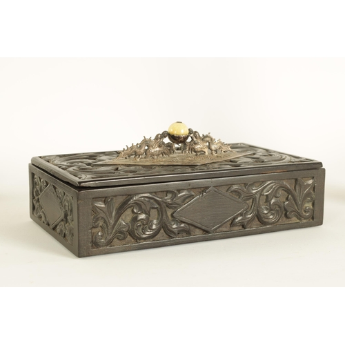 84 - A 19TH CENTURY CHINESE CARVED HARDWOOD (POSSIBLY ZITAN) LIDDED BOX with embossed silver-metal handle... 