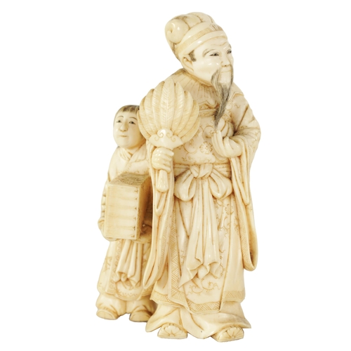 86 - A 19TH CENTURY CHINESE CARVED IVORY FIGURE GROUP depicting a scholar and child. (9cm high)