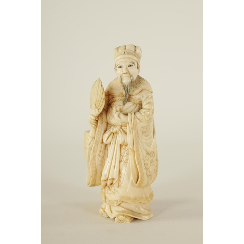 86 - A 19TH CENTURY CHINESE CARVED IVORY FIGURE GROUP depicting a scholar and child. (9cm high)