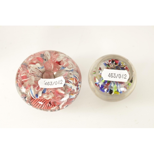 9 - TWO LATE 19TH/EARLY 20TH CENTURY GLASS PAPERWEIGHTS brightly decorated with colourful flower heads. ... 