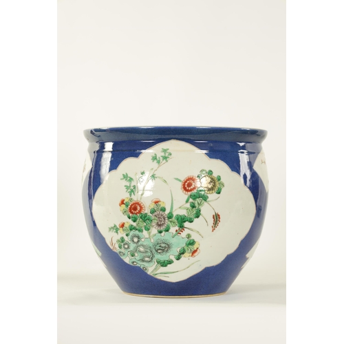 90 - A 19TH CENTURY CHINESE FAMILLE VERTE BULBOUS JARDINIERE decorated with floral panels on a blue groun... 