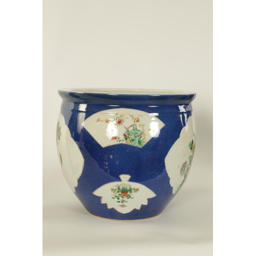 90 - A 19TH CENTURY CHINESE FAMILLE VERTE BULBOUS JARDINIERE decorated with floral panels on a blue groun... 