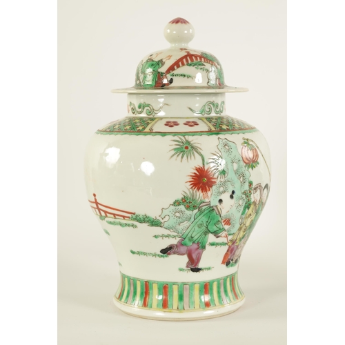 92 - A 19TH CENTURY CHINESE FAMILLE VERTE PORCELAIN JAR AND COVER of baluster form, the body painted with... 