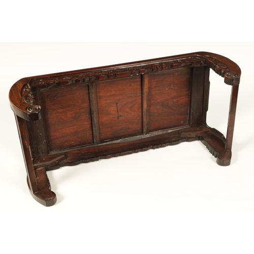 93 - A 19TH CENTURY CHINESE HARDWOOD ALTAR TABLE the panelled top with shaped sides and carved front depi... 