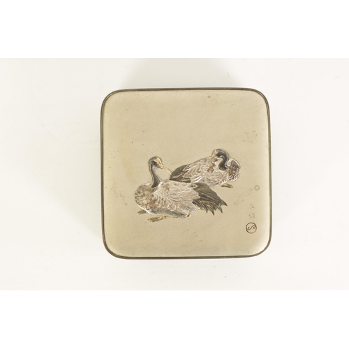 213 - A JAPANESE MEIJI PERIOD SILVER LIDDED BOX decorated with a pair of relief work resting storks - sign... 