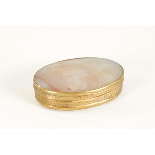 228 - AN EARLY 19TH CENTURY AGATE AND GILT BRASS PILL BOX of oval form with slightly domed agate panels an... 