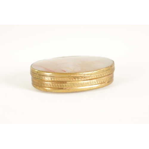 228 - AN EARLY 19TH CENTURY AGATE AND GILT BRASS PILL BOX of oval form with slightly domed agate panels an... 