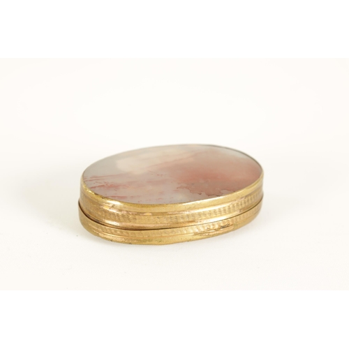 228 - AN EARLY 19TH CENTURY AGATE AND GILT BRASS PILL BOX of oval form with slightly domed agate panels an... 