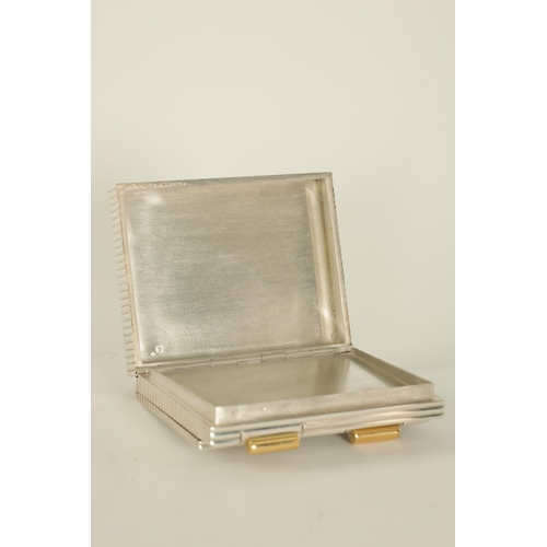 230 - CARTIER, PARIS A MID 20TH CENTURY FRENCH SILVER AND GOLD MOUNTED LADIES POWDER COMPACT the ribbed bo... 