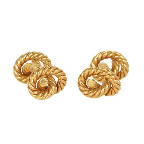 242 - A PAIR OF 18CT GOLD HERMES CUFFLINKS of rope twist design with knot ends, signed 'HERMES' - French h... 