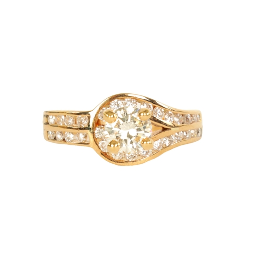 243 - AN 18CT GOLD THIRTY STONE DIAMOND SET SOLITAIRE CLUSTER RING with four-claw raised 'Tiffany' style s... 