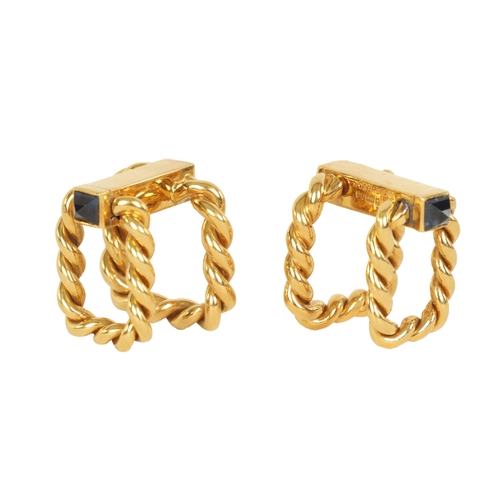 244 - A PAIR OF 18CT GOLD AND SAPPHIRE BOUCHERON CUFFLINKS of hinged rope twist design set with pyramid sa... 