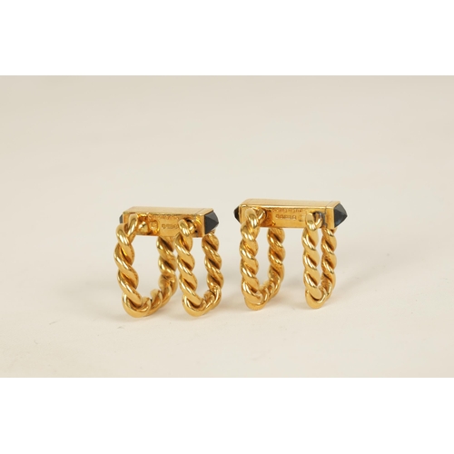 244 - A PAIR OF 18CT GOLD AND SAPPHIRE BOUCHERON CUFFLINKS of hinged rope twist design set with pyramid sa... 