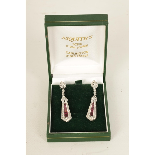 245 - A PAIR OF ART DECCO STYLE 18CT WHITE GOLD, RUBY AND DIAMOND PENDANT DROP EARRINGS of tapering form w... 