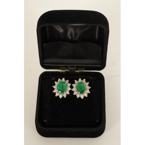 247 - A LARGE PAIR OF EMERALD AND DIAMOND EARRINGS on 9ct gold settings, each having 12 brilliant-cut diam... 