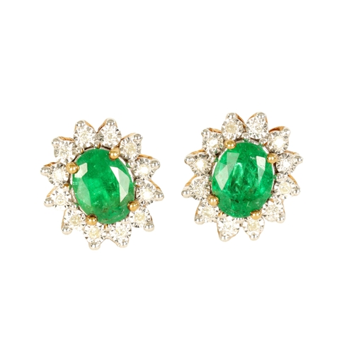 247 - A LARGE PAIR OF EMERALD AND DIAMOND EARRINGS on 9ct gold settings, each having 12 brilliant-cut diam... 