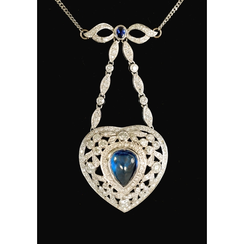 250 - A LADIES 18CT WHITE GOLD SAPPHIRE AND DIAMOND PENDANT on a 9ct white gold chain, the heart-shaped pe... 