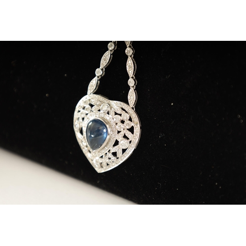 250 - A LADIES 18CT WHITE GOLD SAPPHIRE AND DIAMOND PENDANT on a 9ct white gold chain, the heart-shaped pe... 