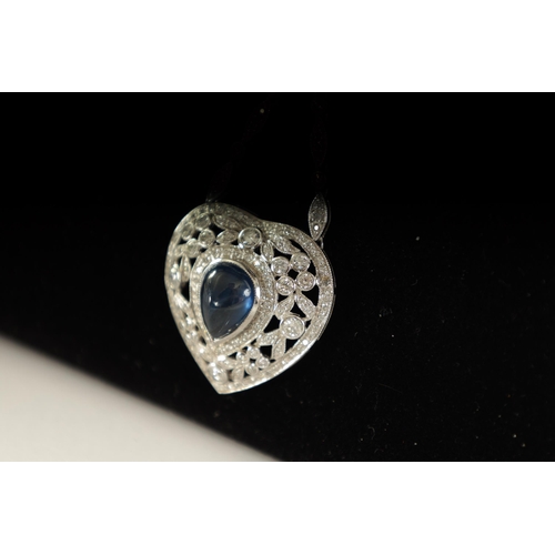 250 - A LADIES 18CT WHITE GOLD SAPPHIRE AND DIAMOND PENDANT on a 9ct white gold chain, the heart-shaped pe... 