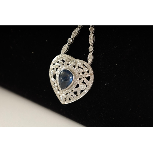 250 - A LADIES 18CT WHITE GOLD SAPPHIRE AND DIAMOND PENDANT on a 9ct white gold chain, the heart-shaped pe... 