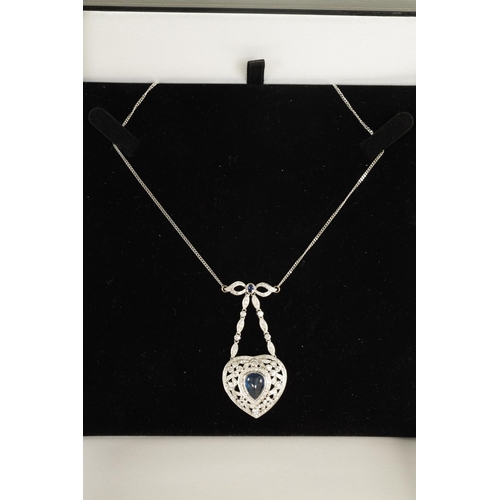 250 - A LADIES 18CT WHITE GOLD SAPPHIRE AND DIAMOND PENDANT on a 9ct white gold chain, the heart-shaped pe... 